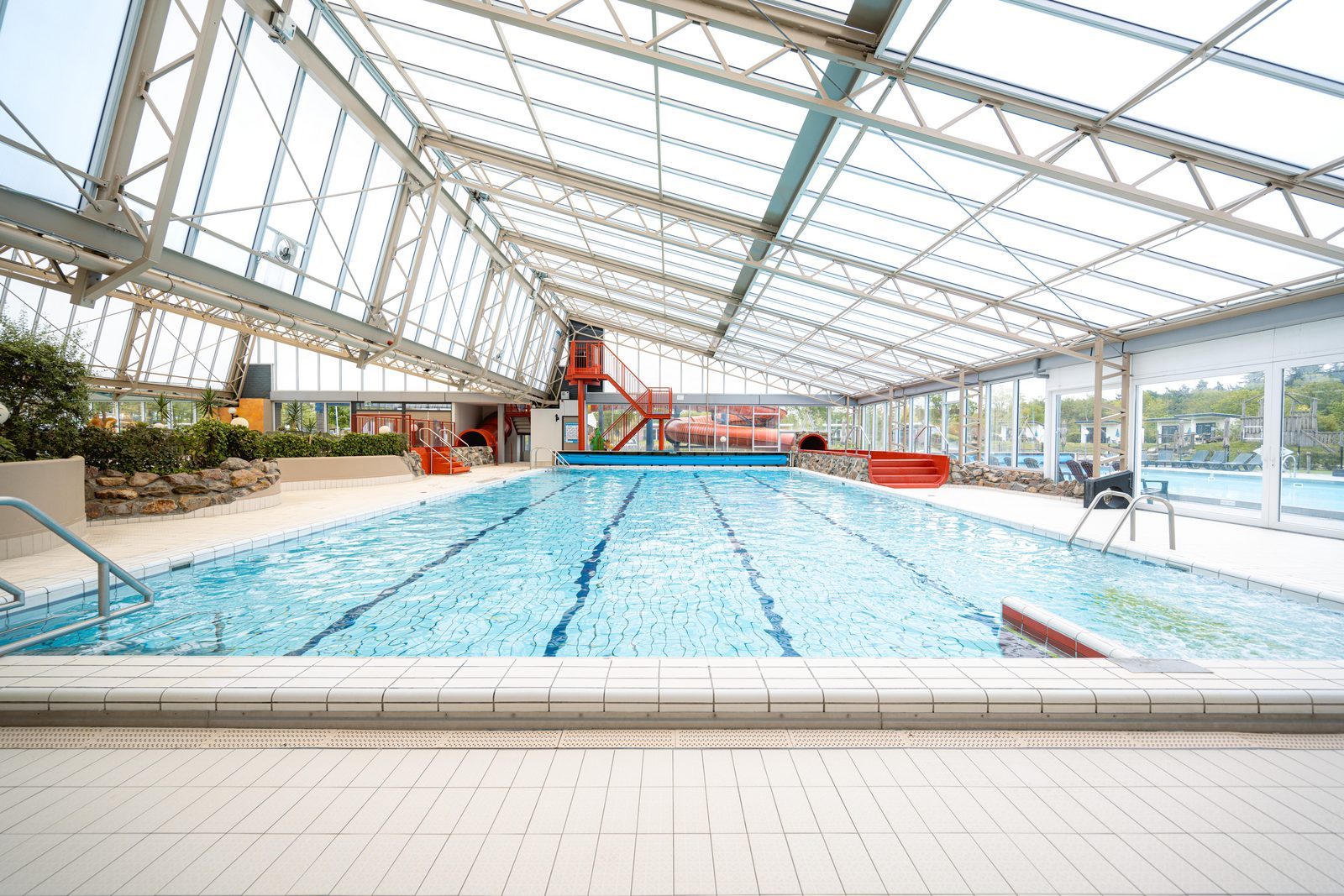 Indoor and outdoor pool with slides