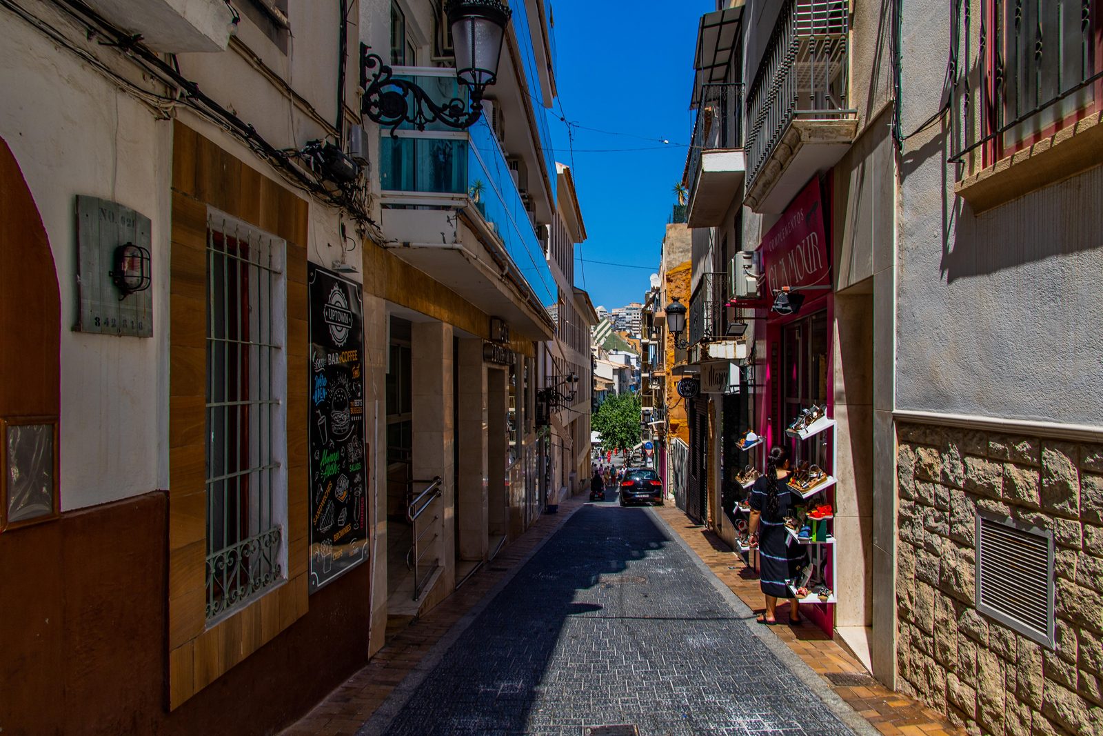 Narrow street with shops in the old center of Benidorm