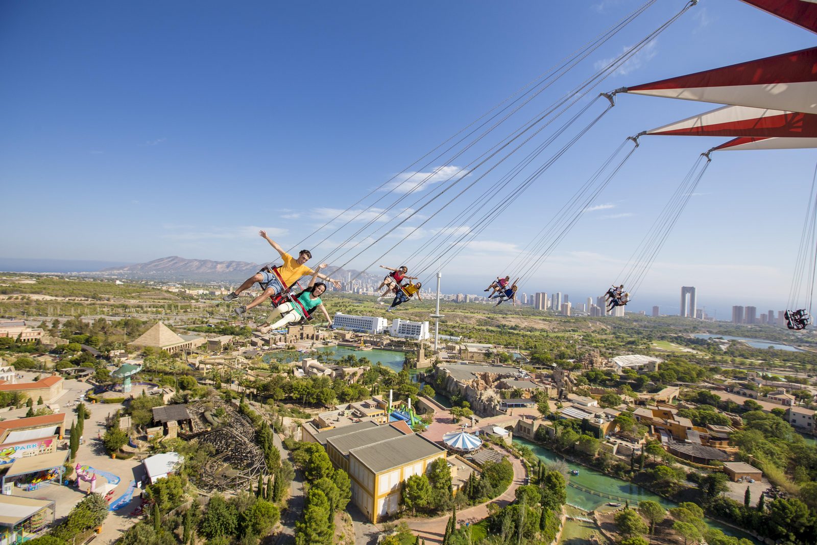 People in the 80 meter high whirligig of Terra Mitica Benidorm