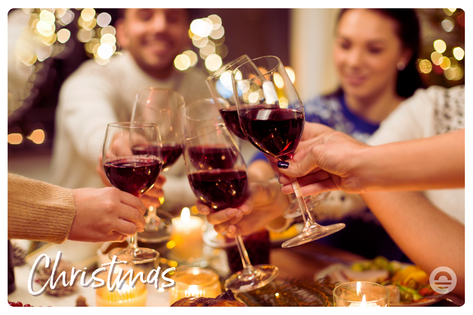 Photo of a family toasting red wine at Christmas dinner