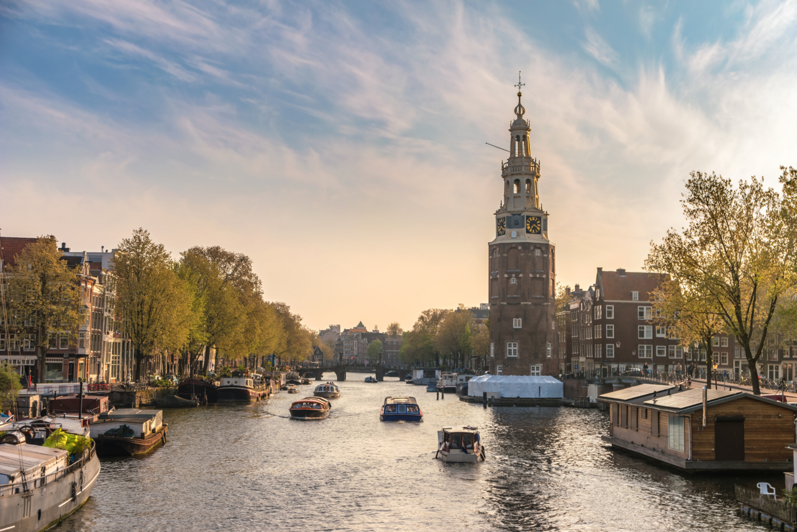Amsterdam gracht water city sun boats