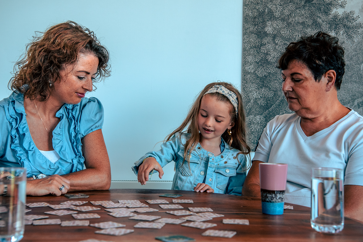 Family-playing-games-in-a-holiday-home-at-europarcs-bad-hulckesteijn