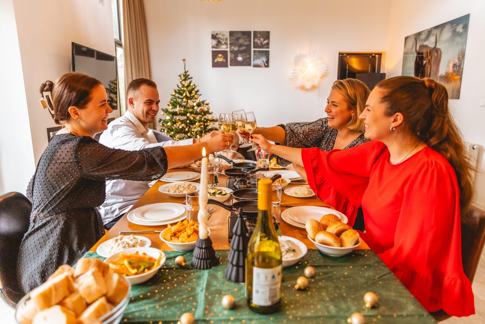 family celebrating christmas new years eve in holiday home