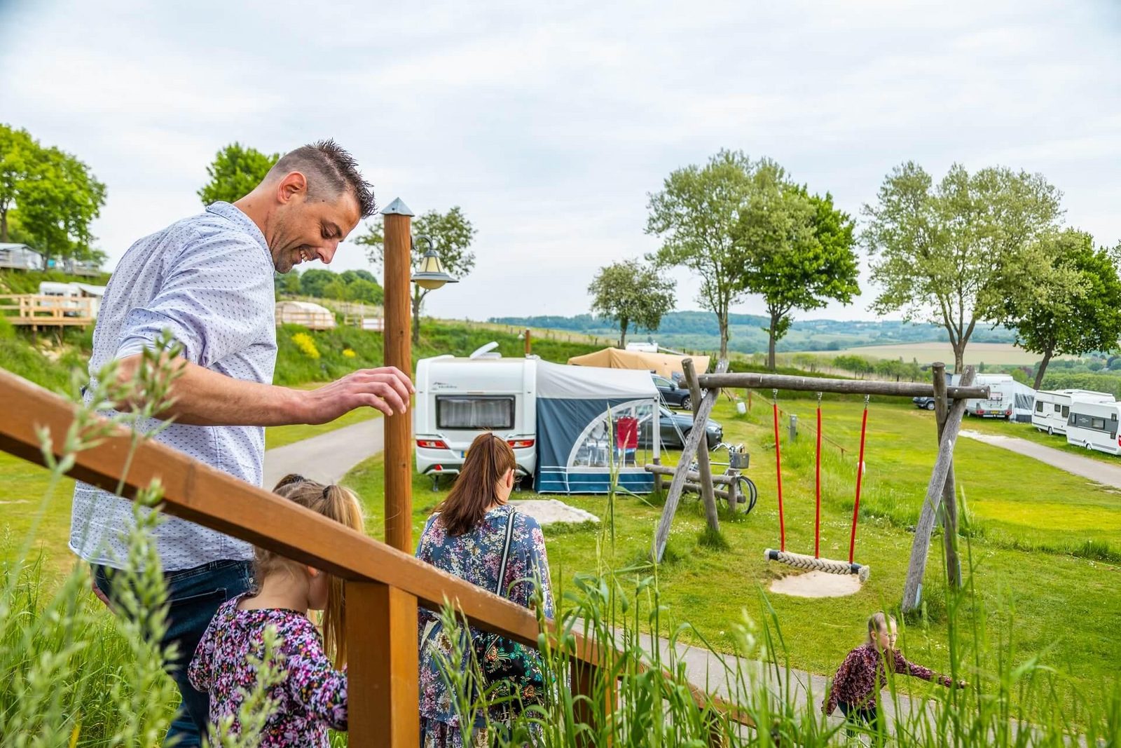 Camping with family and caravans and a view over the hills at EuroParcs Gulperberg