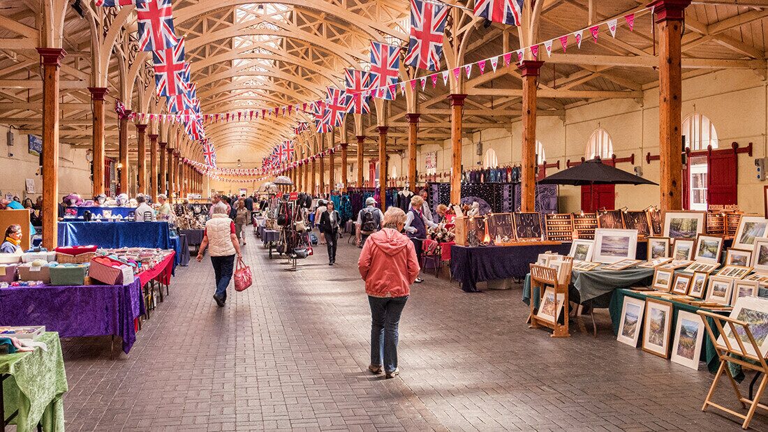 Hall full of english flags and market stands