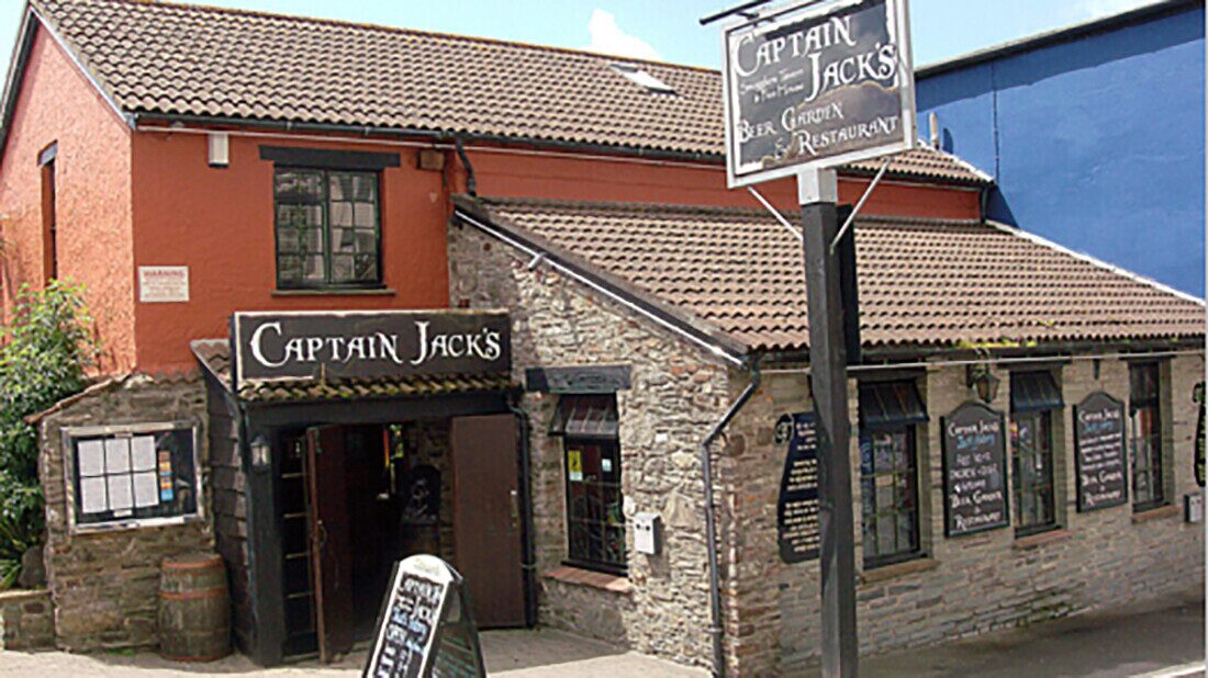 Old building with two signs of Captains Jack's