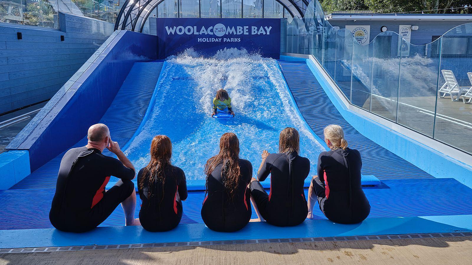Wavesurfer activity instrcutor demonstrating the activity to a variety of children and adults at Twitchen House Holiday Park in Woolacombe.
