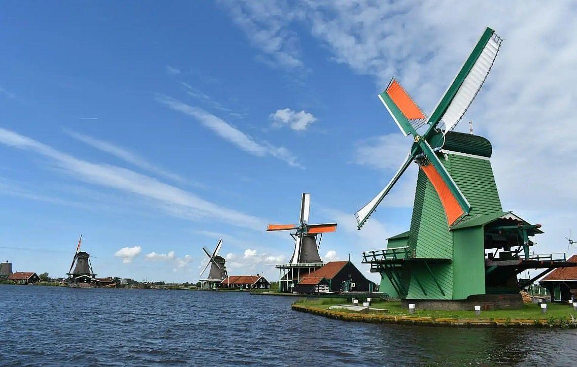 Windmills by the water in North Holland