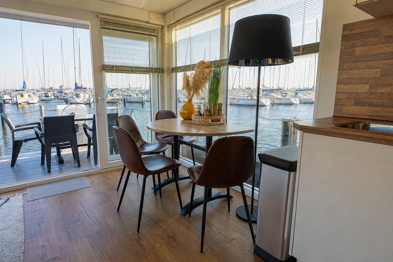Modern dining and living area with views of the Veerse Meer