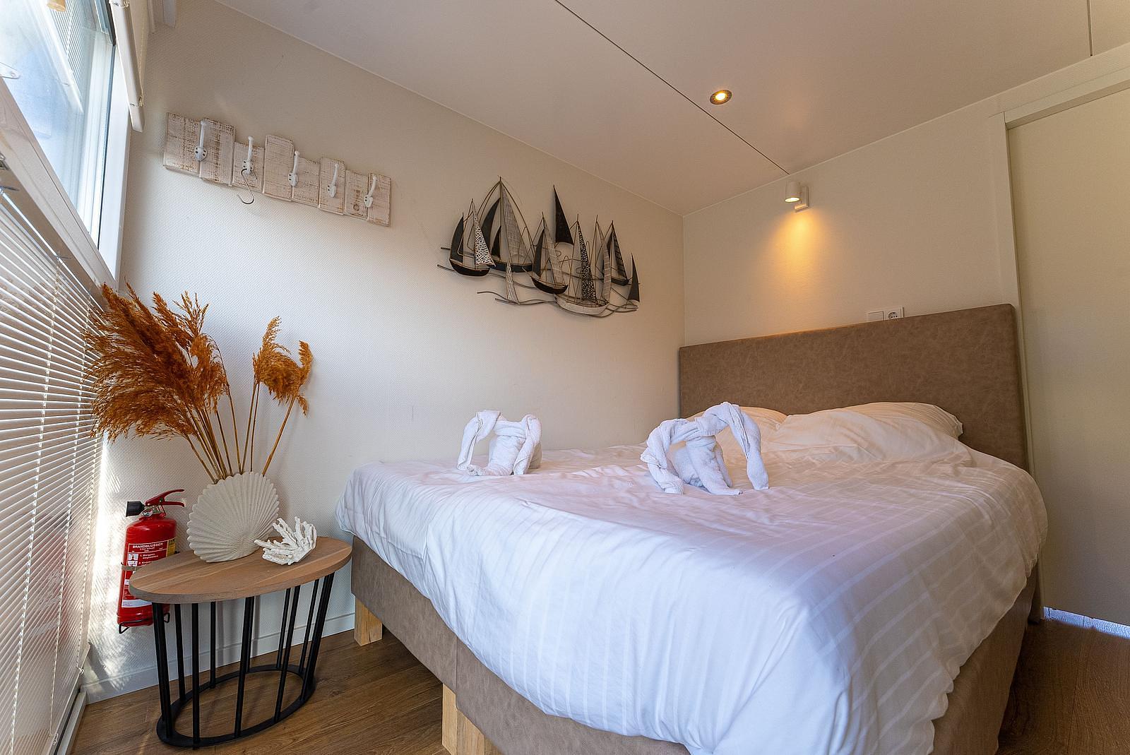 Comfortable bedroom in the houseboat at the Veerse Meer