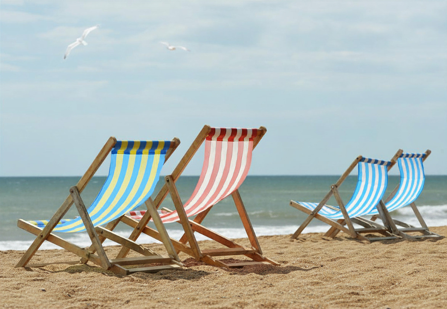 deckchairs on beach deckchairs on a sandy beach