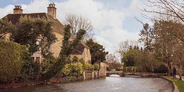 The River Windrush flowing through Bourton-on-the-Water, one of the Cotswolds' most picturesque villages