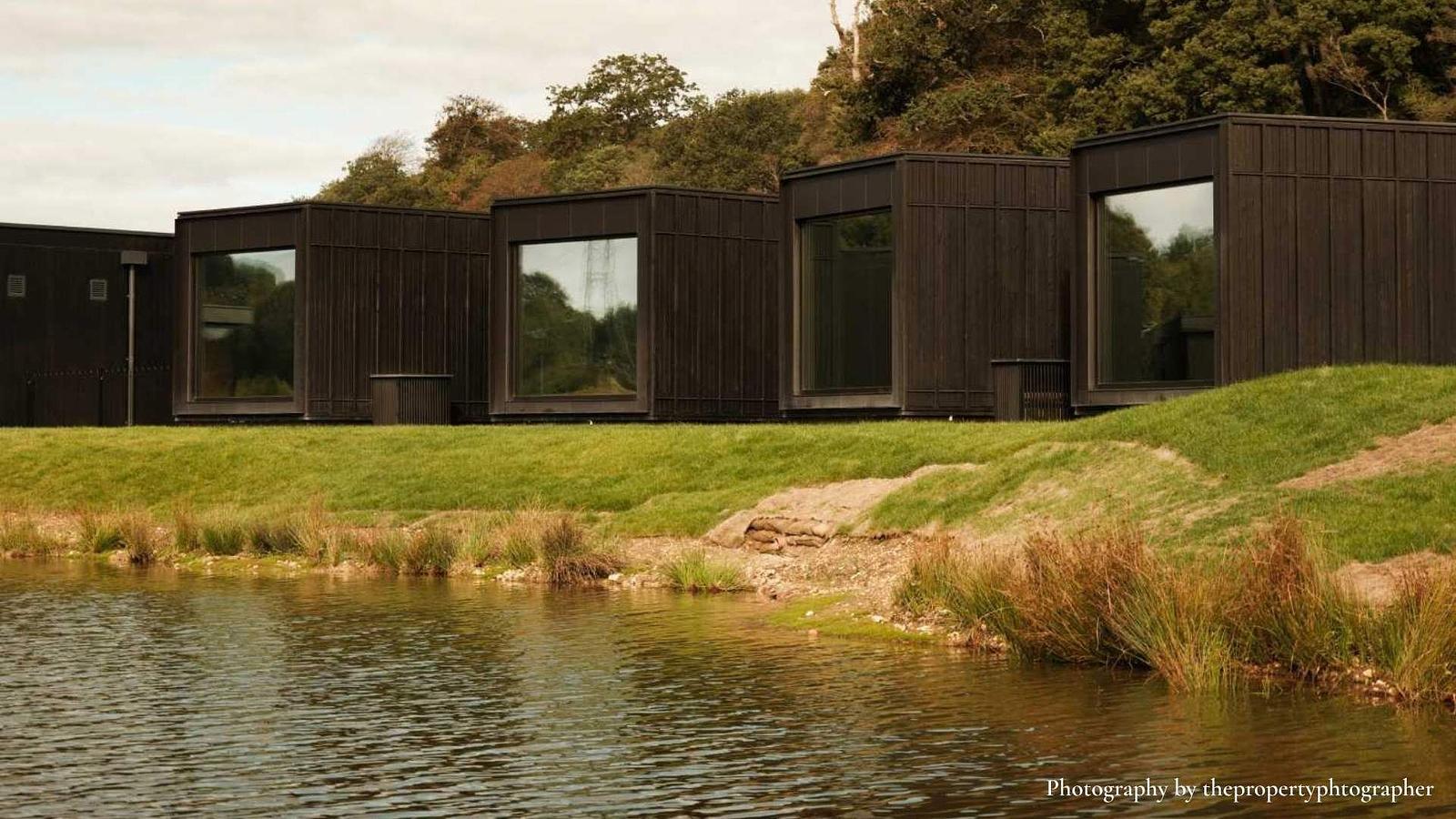 Interior of a luxury lakeside treatment pod overlooking Firefly Lake at Firefly Spa, Dorset