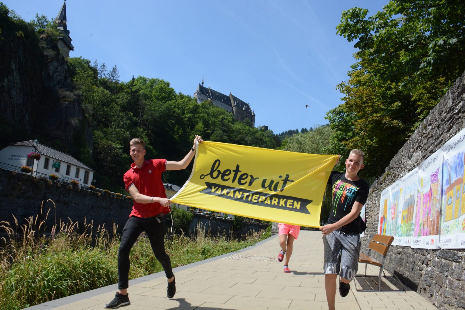 Boys running with flag Vianden